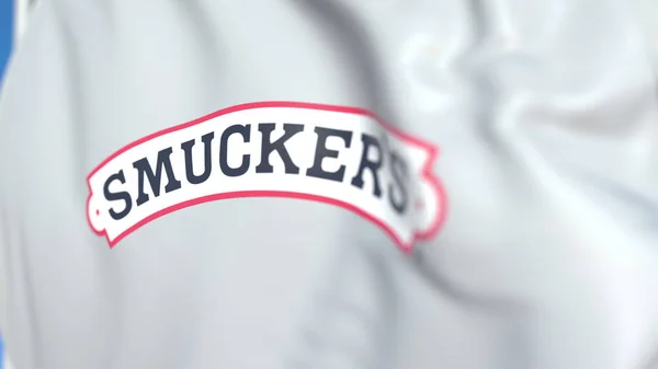 Bandiera battente con il logo della J. M. Smucker Company, primo piano. Rendering editoriale 3D — Foto Stock