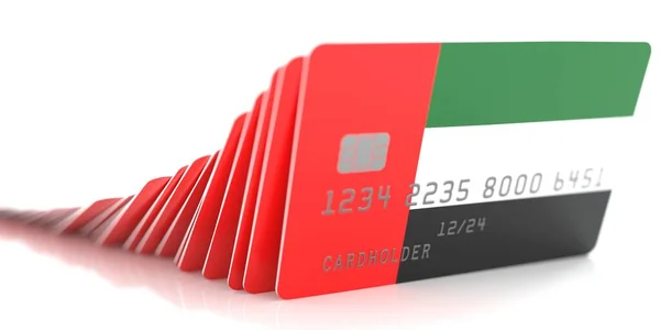 Эффект домино с падением кредитных карт с флагами ОАЭ. Концептуальный 3D рендеринг — стоковое фото