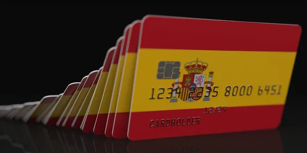 Domino effect, falling credit cards with flag of Spain, fictional data on card mockups. Financial crisis related 3d rendering