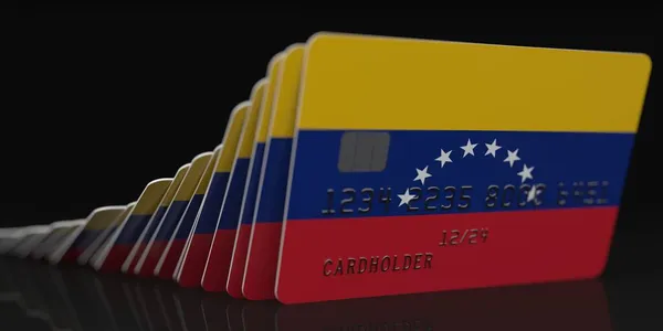 Domino efekt, padající kreditní karty s vlajkou Venezuely, fiktivní data na kartě mokups. Finanční krize související 3D vykreslování — Stock fotografie