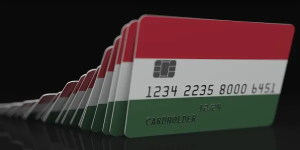 Falling plastic cards with flag of Hungary on dark background, fictional data on card mockups. Economic crisis conceptual 3d rendering