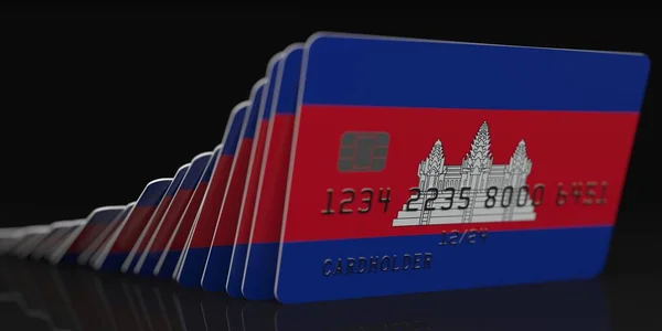 Falling plastic cards with flag of Cambodia on dark background, fictional data on card mockups. Economic crisis conceptual 3d rendering