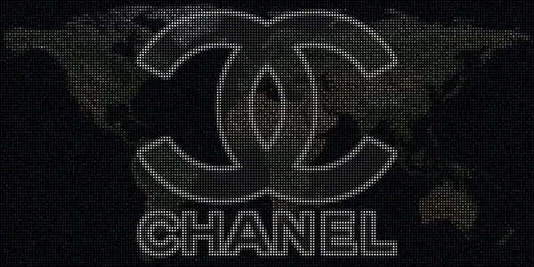 Logo van CHANEL gemaakt met stippen en de wereldkaart. Redactionele conceptuele illustratie — Stockfoto