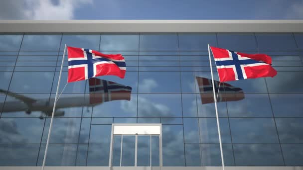 Avión de aterrizaje y banderas de Noruega en la terminal del aeropuerto — Vídeos de Stock