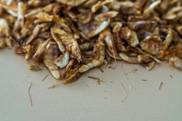 Pile of Dried Crayfish on brown background — Stock Photo, Image