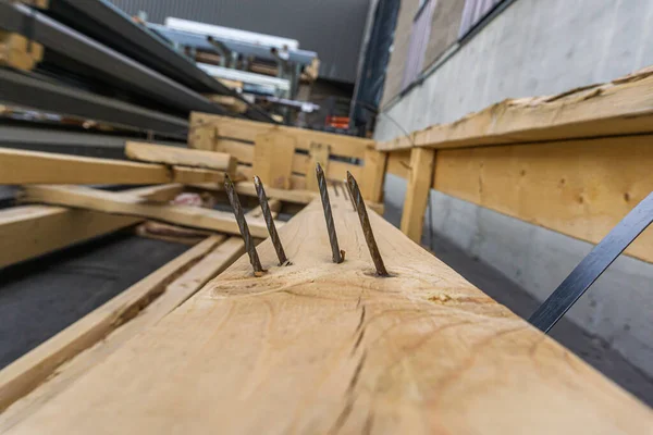 Nails sticking out of pieces of Waste Wood — Stock Photo, Image