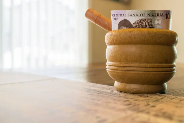 Nigerian Naira Notes in Mortar with Pestle - Financial Concept — Stock Fotó