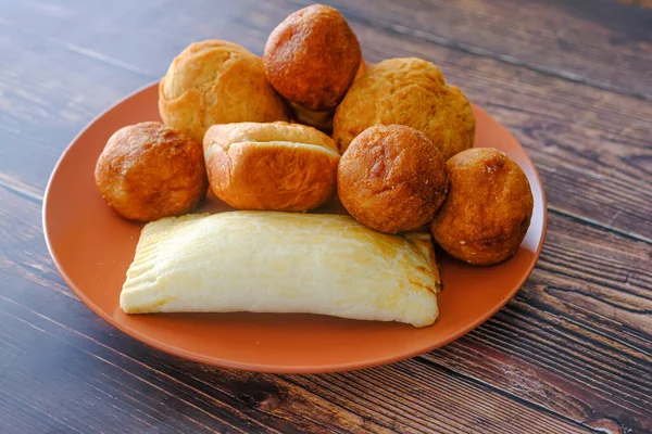 Nigerian Snacks Meat Pie, Puff Puff , buns and Egg roll — Stock Photo, Image