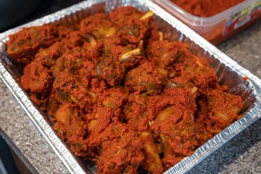 Tray of Nigerian peppered chicken ready to eat