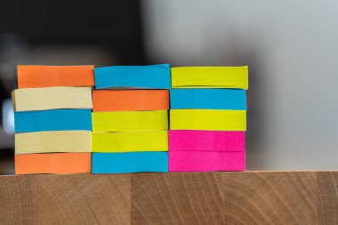 pile of sticky notes on office tabl