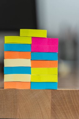 pile of sticky notes on office tabl