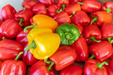 Pile of Organic Fresh Bell Peppers on display in supermarket