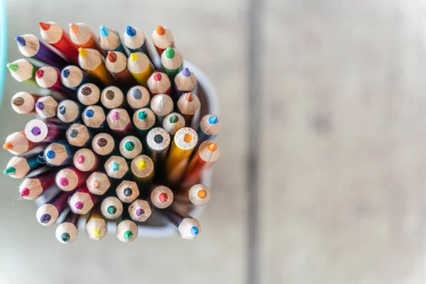 cup full of coloring pencils for office