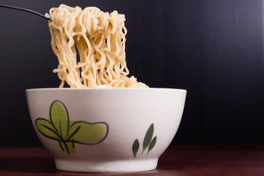 Chopsticks are hot noodles., Instant noodle It is popular in East Asian countries.