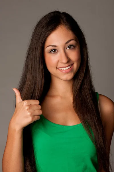 Attractive young woman showing thumb up — Stock Photo, Image