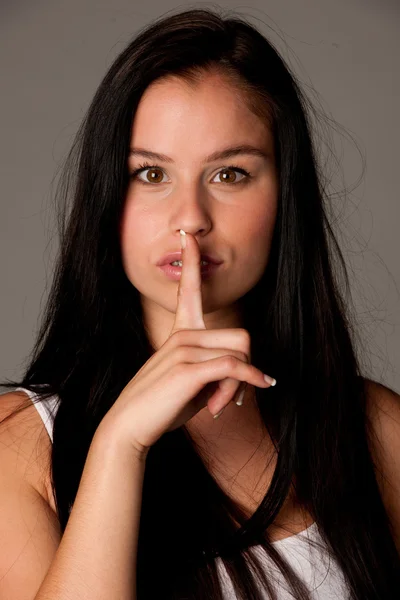 Portrait of attractive young woman calling for silence.? — Stock Photo, Image