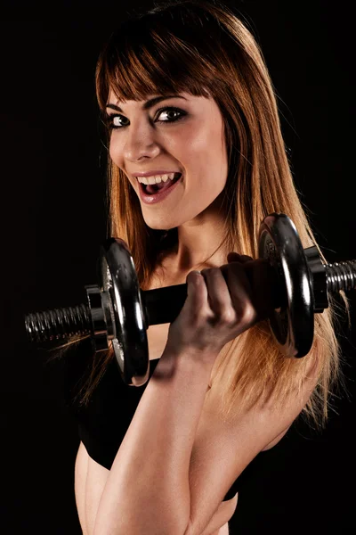 Joven chica en forma haciendo ejercicio con pesas - Retrato de guapa que —  Fotos de Stock