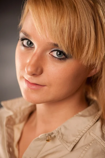 Portrait of attractive young blonde woman in shirt — Stock Photo, Image