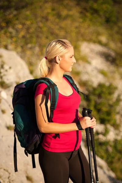 Woman on trekking - Beautiful blonde girl hiking on mountains — Stock Photo, Image