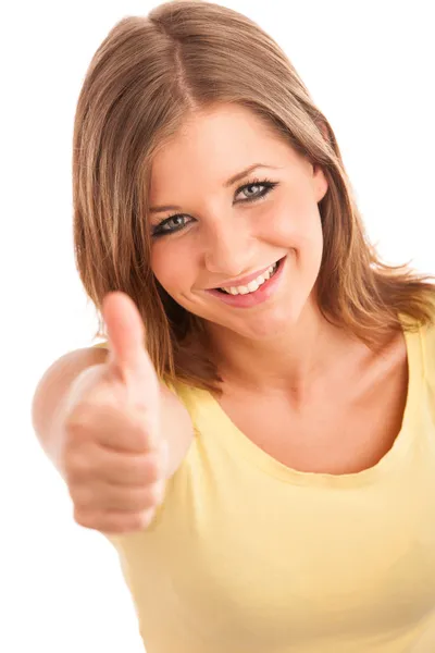 Beautiful young woman with blue eyes showing thumb up — Zdjęcie stockowe