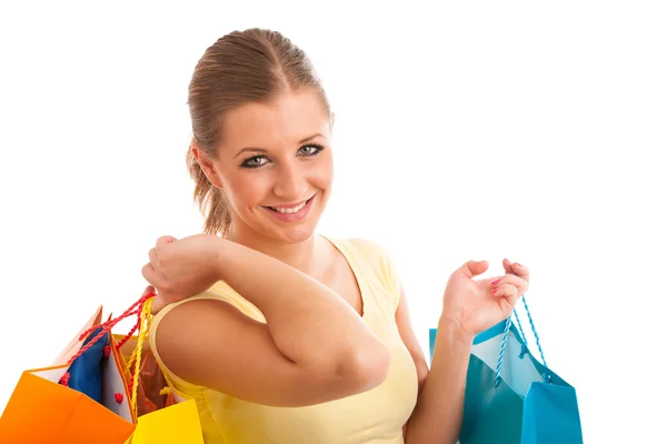 Vonzó fiatal nő, élénk bevásárló táskák, elszigetelt, felett — Stock Fotó
