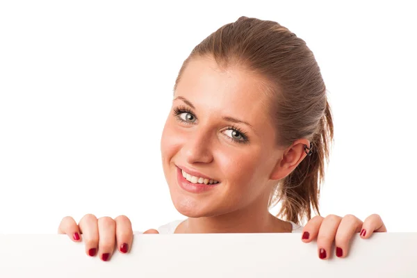 Attractive young woman holding white board — Stock Photo, Image