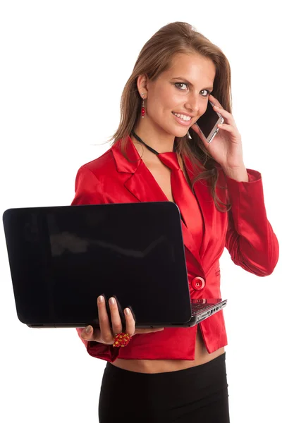 Business woman in red dress working on alptop — Stock Photo, Image