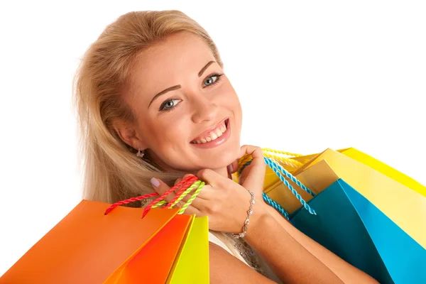 Menina loira atraente com sacos de compras coloridos — Fotografia de Stock