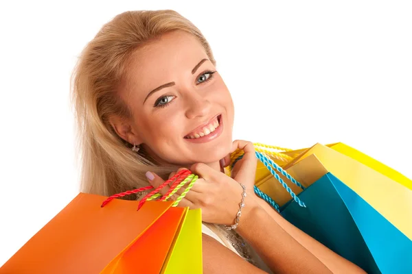 Jolie fille blonde avec des sacs à provisions colorés — Photo