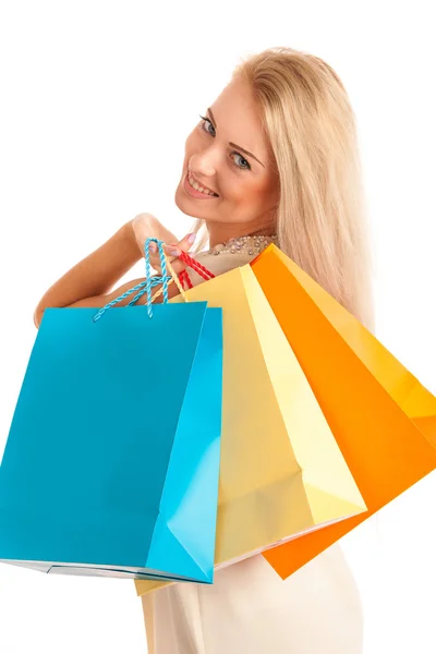 Attraente ragazza bionda con borse colorate — Foto Stock