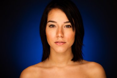 Beauty portrait of attractive asian girl on dark studio backgrou clipart