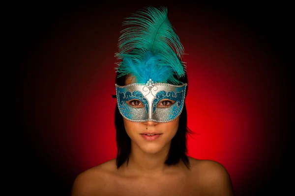 Beautiful young woman with venice carnival mask studio portrait — Stock Photo, Image