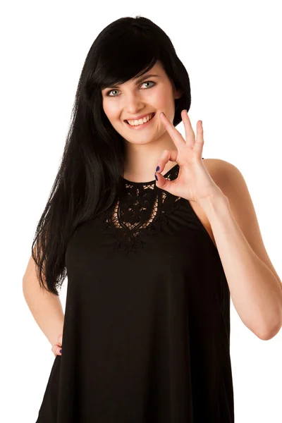 Atrakcyjna młoda kobieta pokazano ok znak z kciukiem — Zdjęcie stockowe