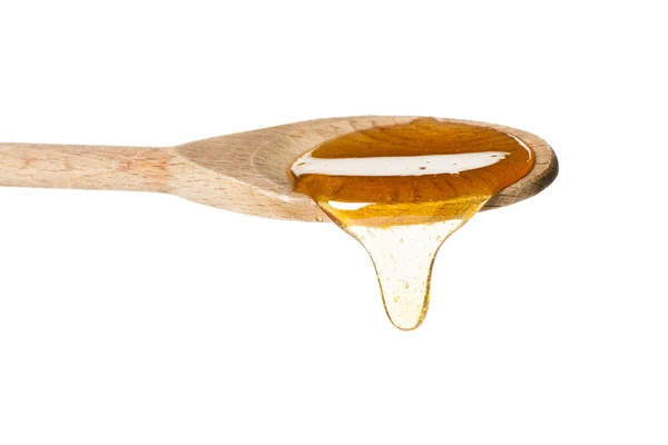 A spoon full of honey — Stock Photo, Image