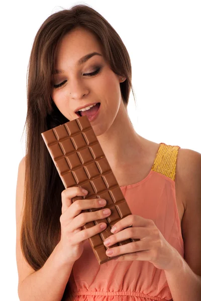 Beautiful young caucasian woman eating chocolate — Stock Photo, Image
