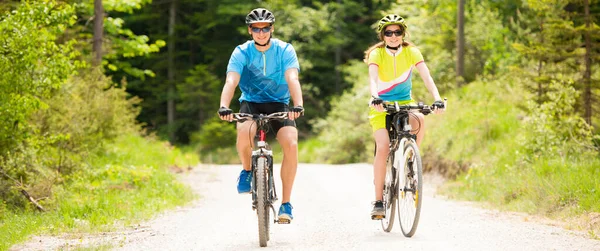 Active Young Couple Biking Forest Road Mountain Spring Day — Stock Photo, Image