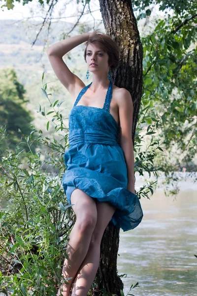 Young beautiful woman near river — Stock Photo, Image