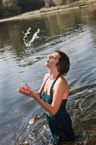 Beautiful young woman in the river — Stock Photo, Image