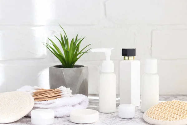 Different eco-friendly bathroom accessories and cosmetics. Various moisturizers, ear sticks, facial sponges, and soaps. Zero waste concept — Stock Photo, Image