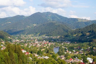 A panoramic view of the village in the mountains. Ukrainian village Verkhovyna is located among the Carpathian Mountains. Tourism.
