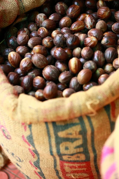 Big bag with nutmeg in indian market — Stock Photo, Image