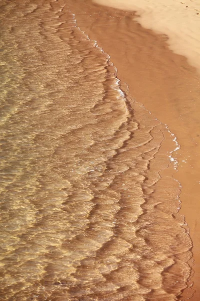 Sandstrand och våg — Stockfoto