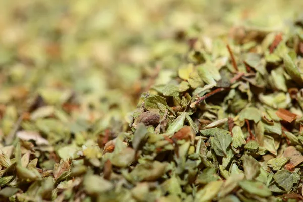 Orégano seco como fondo alimentario —  Fotos de Stock