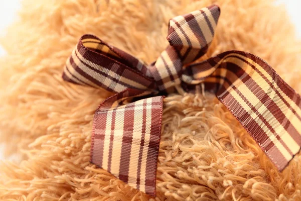 Satin bow on brown teddy bear — Stock Photo, Image