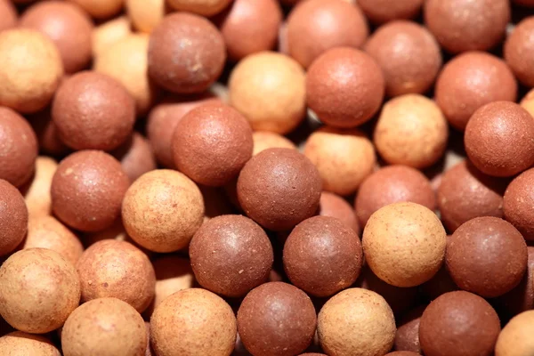 bej renkli kozmetik çok renkli topları arka plan, makro görünümü rouge