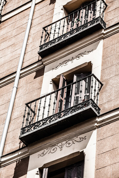 Mediterranean architecture in Spain. Old apartment building in Madrid.