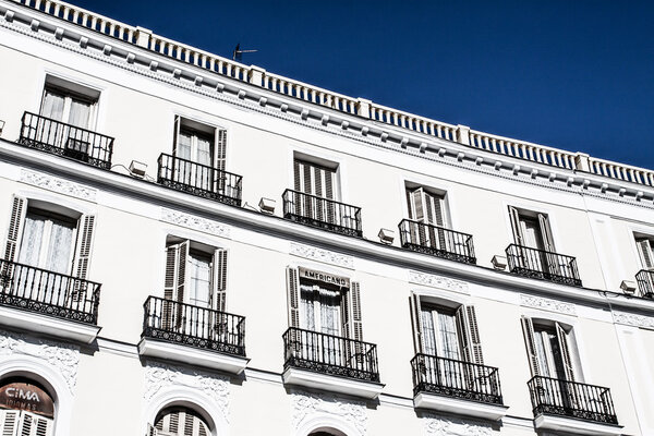 Mediterranean architecture in Spain. Old apartment building in Madrid. ( HDR image )