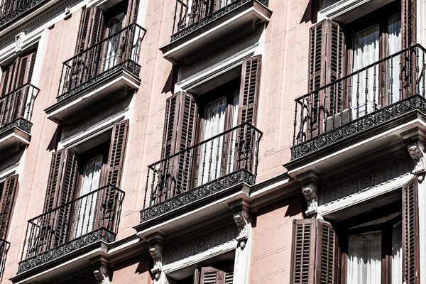 Mediterranean architecture in Spain. Old apartment building in Madrid.