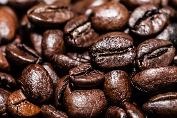 Coffee beans on grunge wooden background — Stock Photo, Image