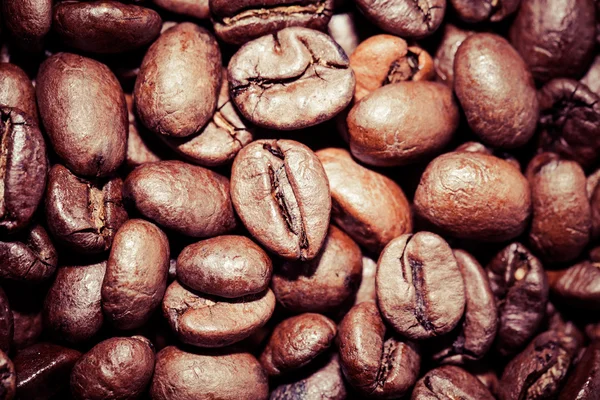 Coffee beans on grunge wooden background — Stock Photo, Image